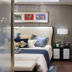 Big cosy bed in modern, eclectic bedroom