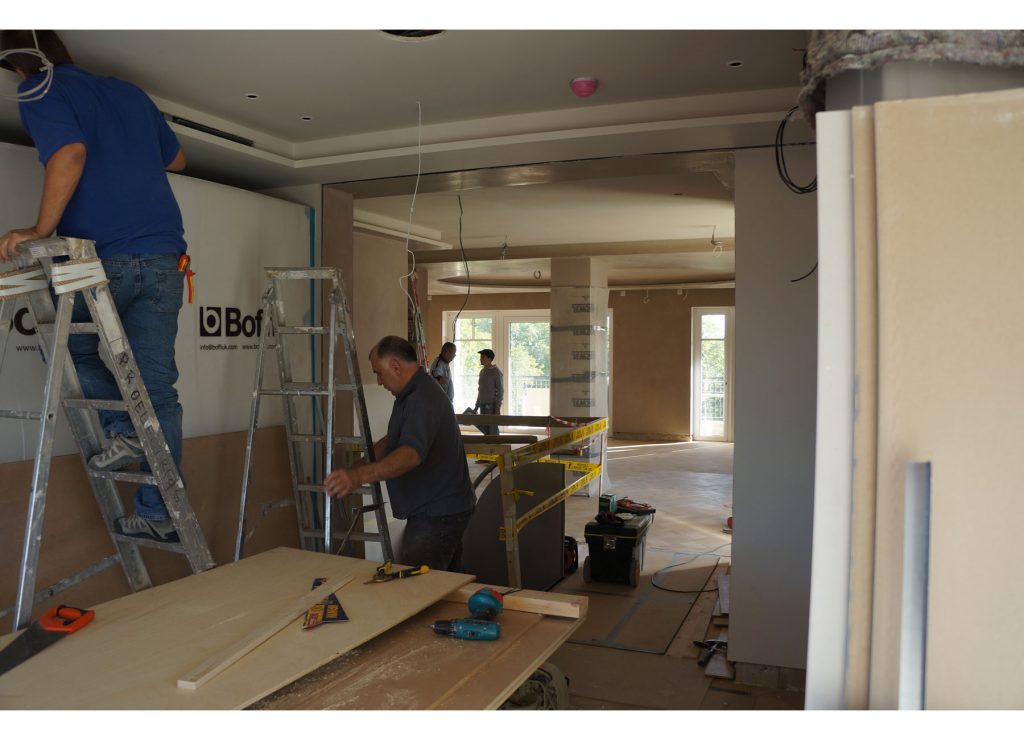 ANBM team working on the ceiling for house construction