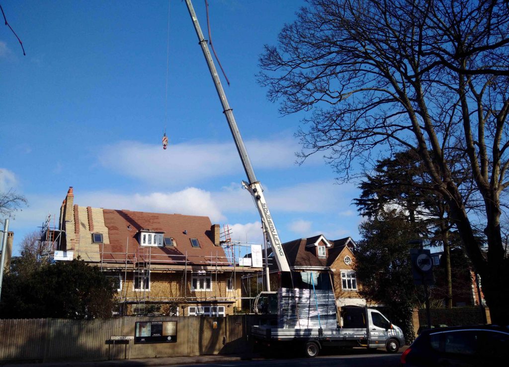 ANBM team reroofing a house for a renovation project