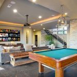 Play room with pool table and projector screen