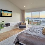 Modern bedroom with flat TV and view on San Diego Bay
