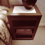Wooden bedside table with shelves