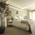 Beige bedroom with upholstered headboard