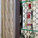 Drinks cabinet with glass shelves & Smirnoff Vodka