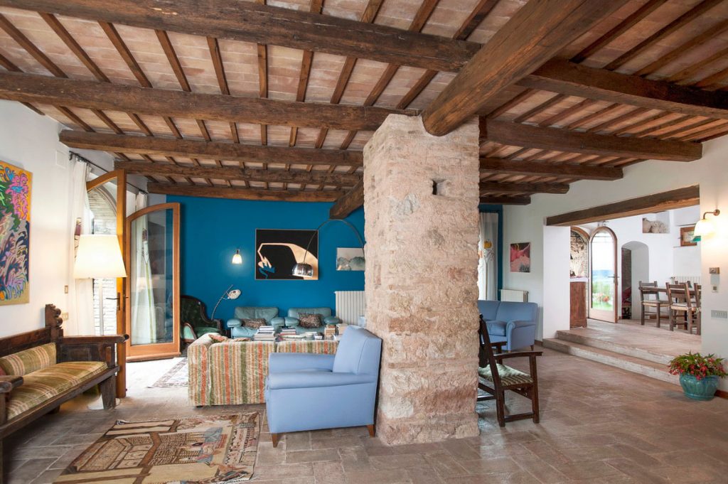 Spacious living area with exposed wooden beams