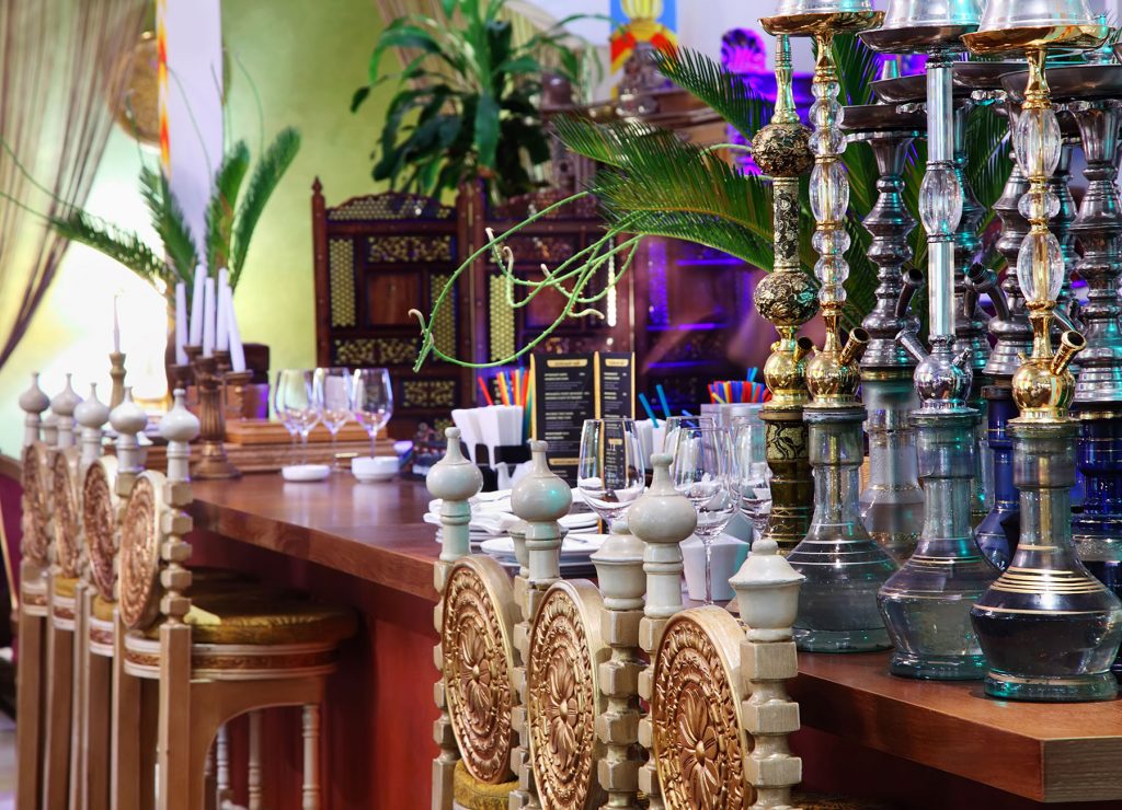 Hookahs stood on table in modern Indian restaurant