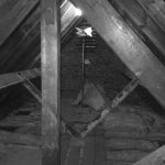 ANBM working on attic insulation for a house