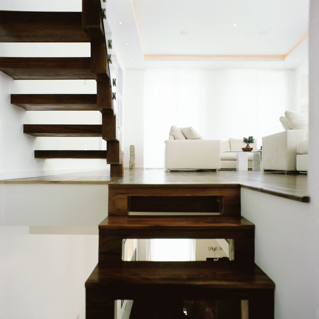 Wooden staircases leading to living area