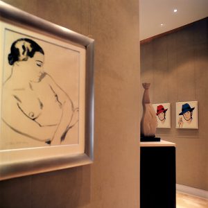 Series of Framed ArtWork in hallway of luxury property
